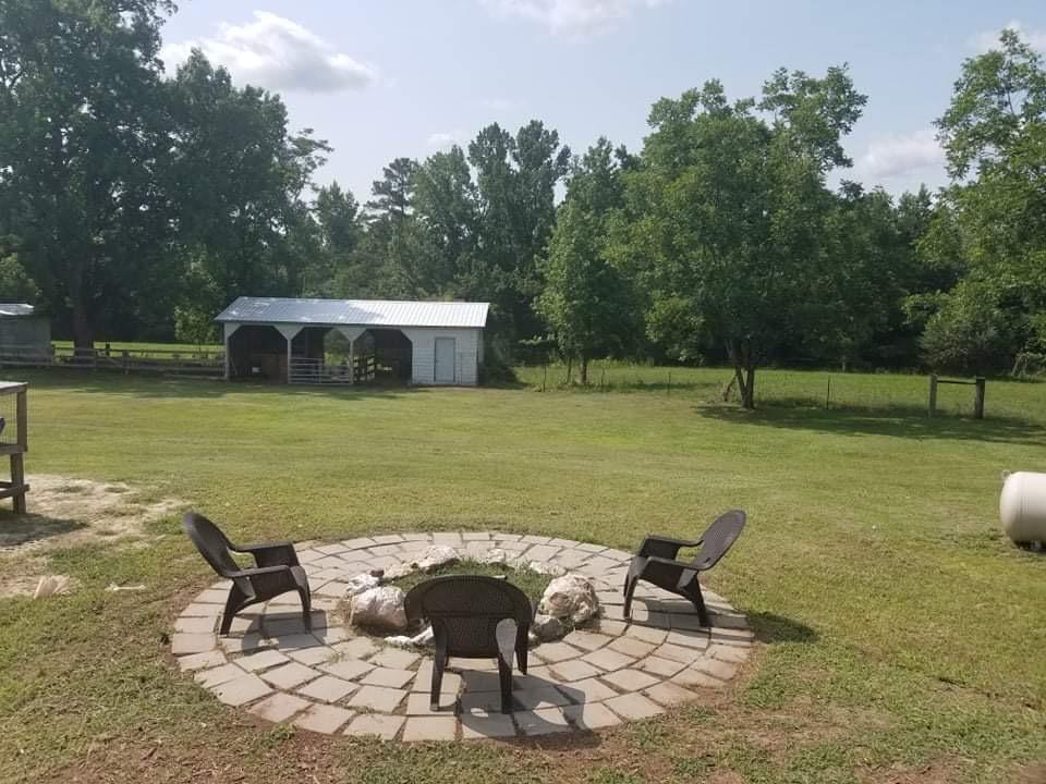 315 Green Lake Road Rockingham, NC 28379 - Photo 9 of 47 Firepit in back yard and 3 bay shed in background.