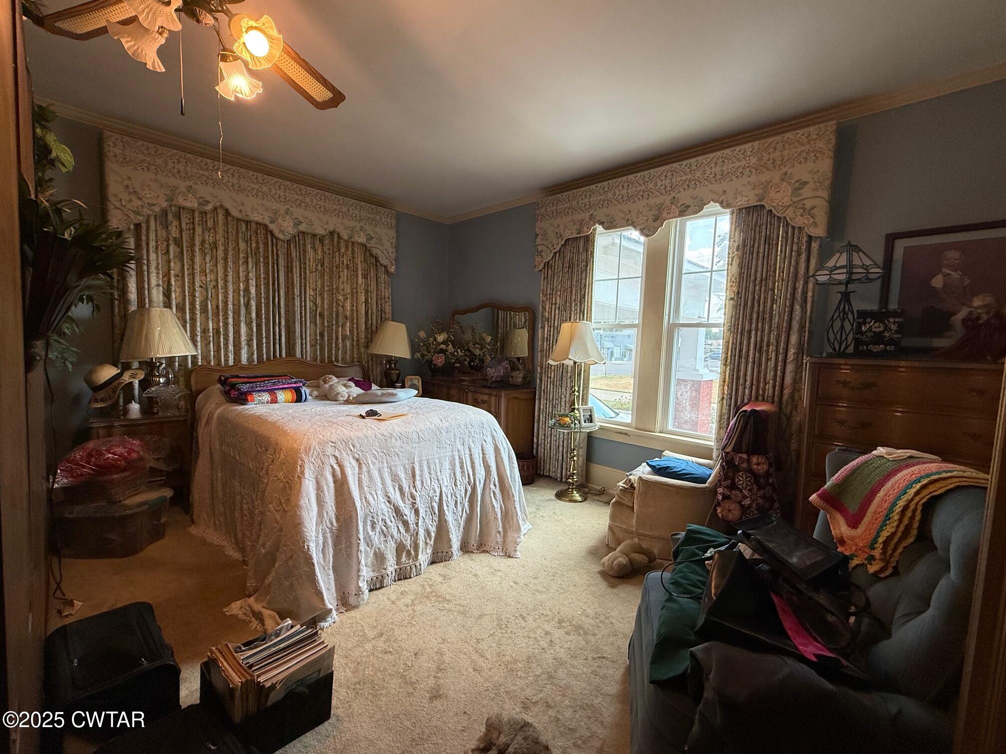 209 North Main Street Ridgely, TN 38080 - Photo 22 of 58 a bedroom with a bed and wooden floor