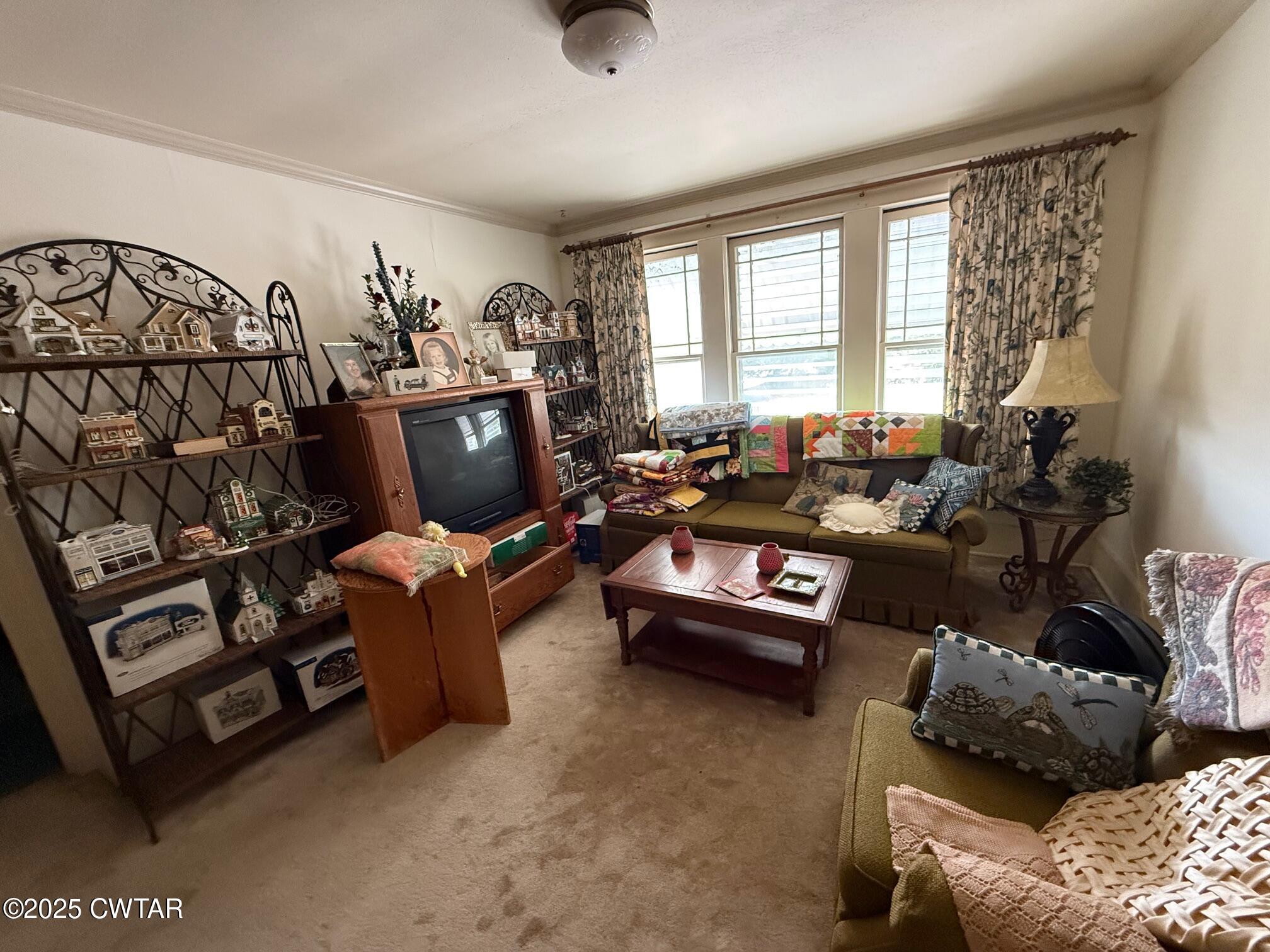 209 North Main Street Ridgely, TN 38080 - Photo 28 of 58 a living room with furniture and a window