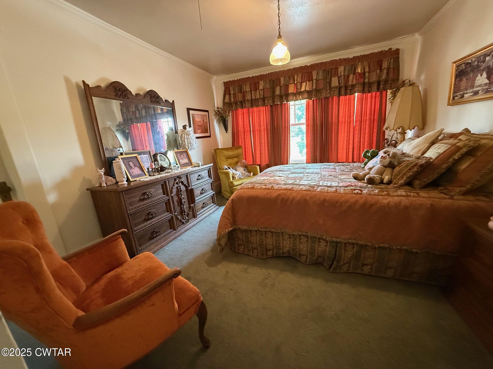 209 North Main Street Ridgely, TN 38080 - Photo 30 of 58 a blue bed sitting in a bedroom next to a window