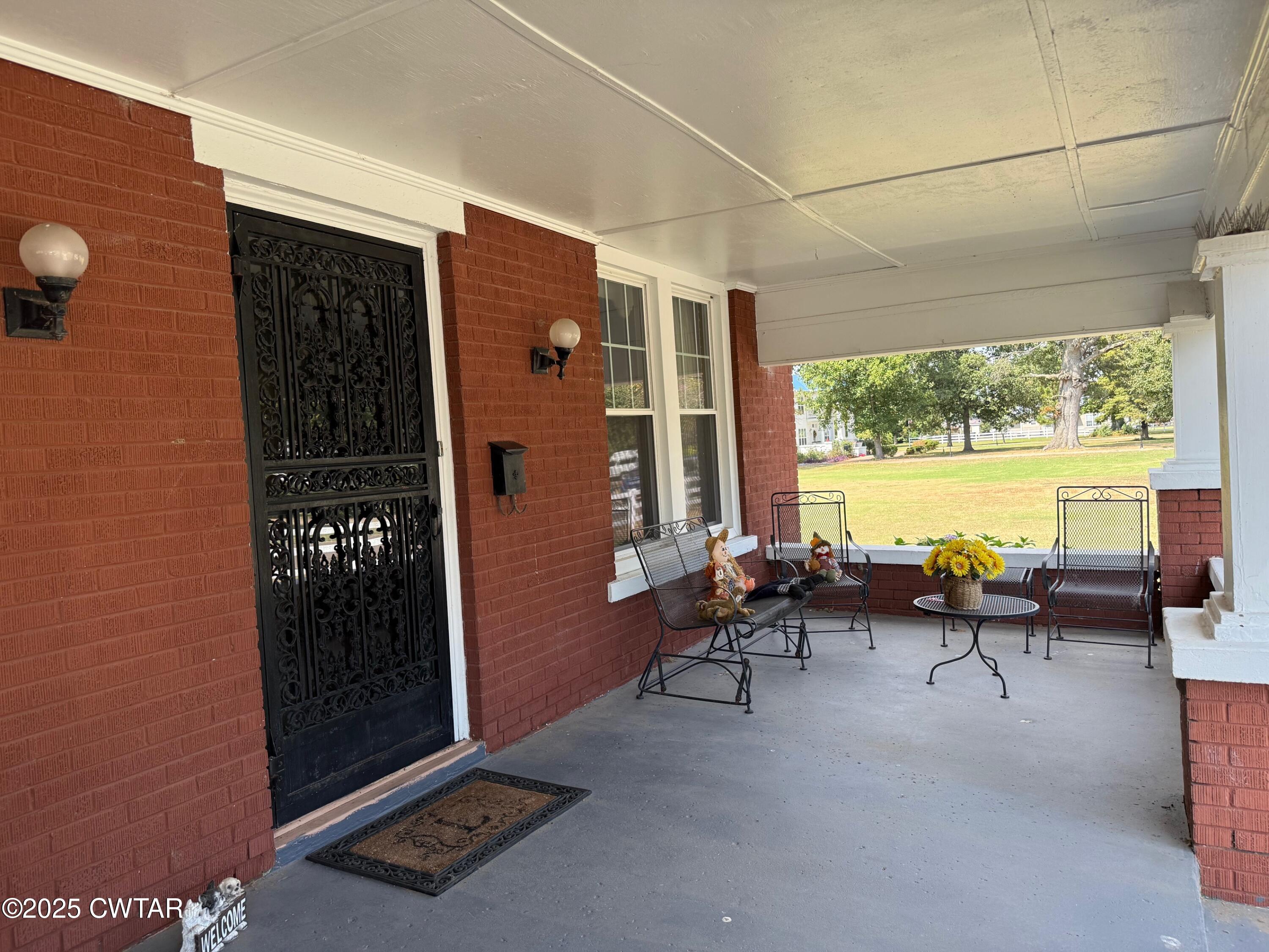 209 North Main Street Ridgely, TN 38080 - Photo 3 of 58 a living room with furniture and large windows