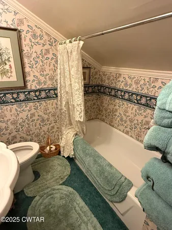 a bedroom with furniture and a chandelier