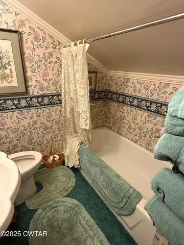 a bedroom with furniture and a chandelier