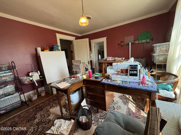 a bedroom with furniture and a book shelf