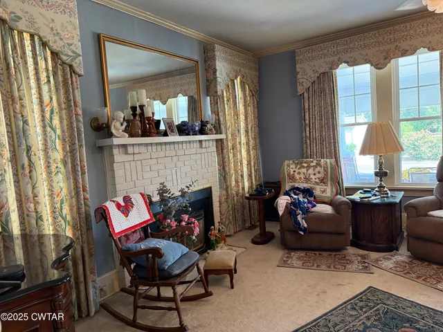 a living room with furniture and a fireplace