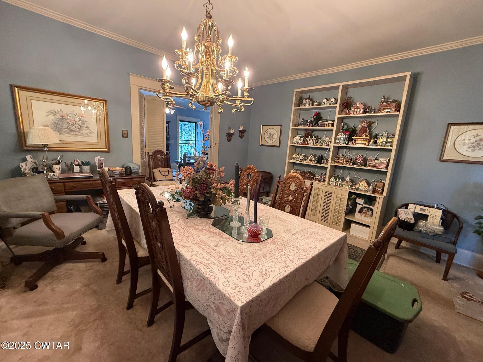 209 North Main Street Ridgely, TN 38080 - Photo 8 of 58 a view of a dining room with furniture a chandelier and window