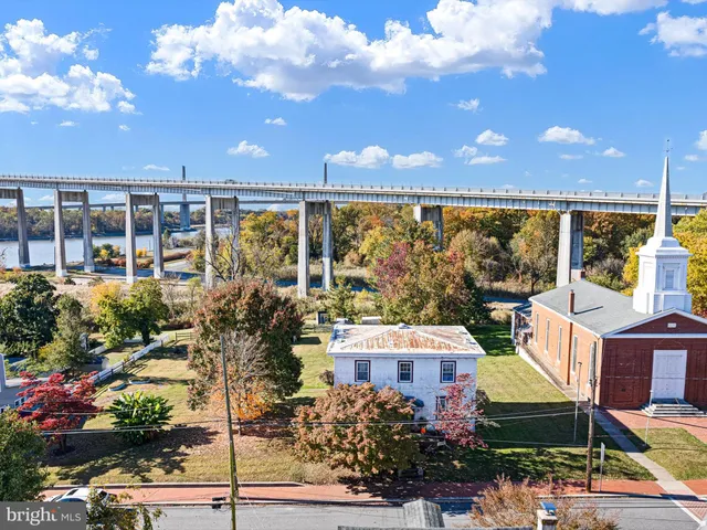 an aerial view of a house with a lake view