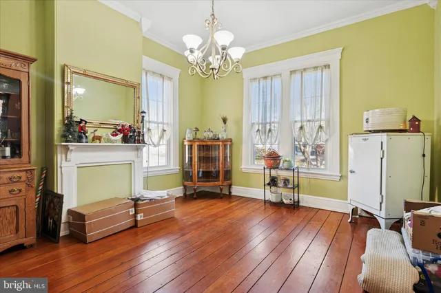 a view of a livingroom with furniture and a bed
