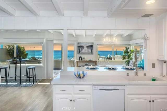a kitchen with a sink and large window