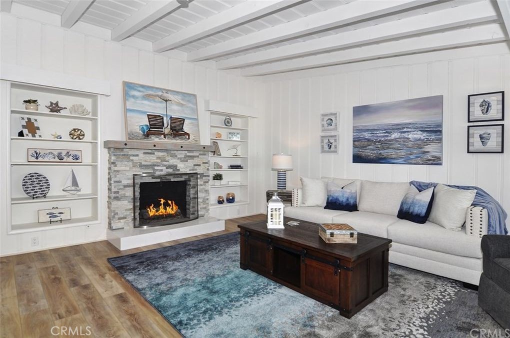 35325 Beach Road Dana Point, CA 92624 - Photo 15 of 44 a living room with furniture and a fireplace