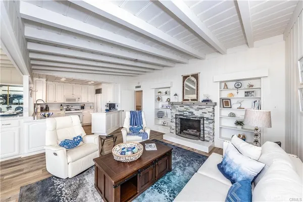 a living room with furniture fireplace and a table