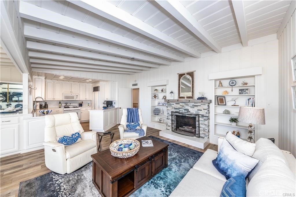 35325 Beach Road Dana Point, CA 92624 - Photo 16 of 44 a living room with furniture fireplace and a table
