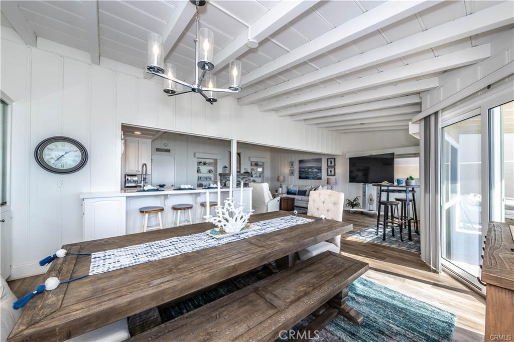 35325 Beach Road Dana Point, CA 92624 - Photo 19 of 44 a living room with kitchen view and a table