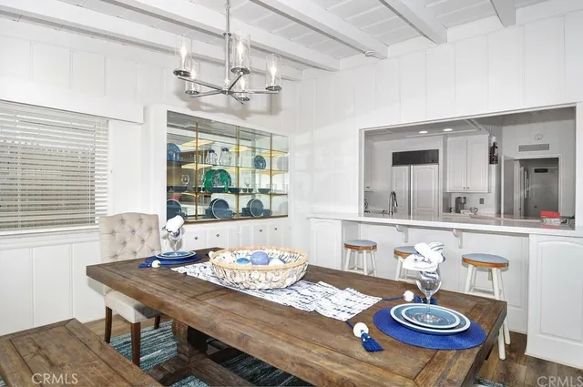 a table and chairs in a dining room with a table