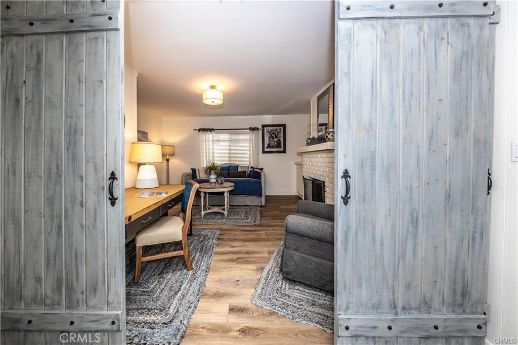35325 Beach Road Dana Point, CA 92624 - Photo 23 of 44 a living room with furniture a fireplace and a table
