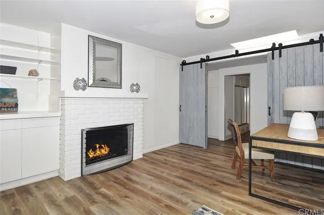 a view of livingroom with furniture and a fireplace