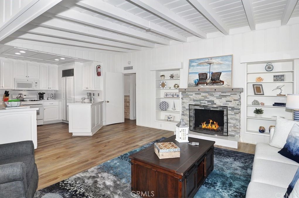 35325 Beach Road Dana Point, CA 92624 - Photo 30 of 44 a living room with furniture and a fireplace