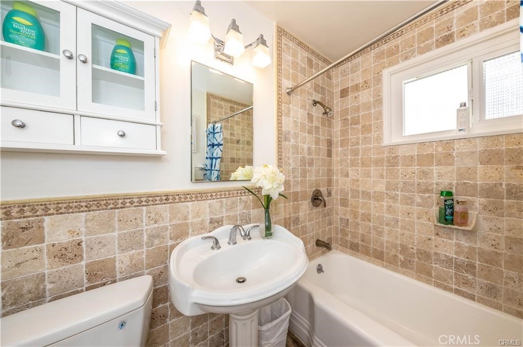 35325 Beach Road Dana Point, CA 92624 - Photo 34 of 44 a bathroom with a sink a toilet and shower