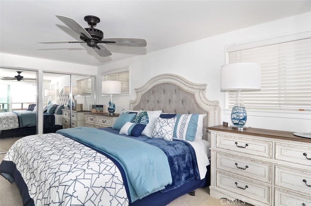 35325 Beach Road Dana Point, CA 92624 - Photo 39 of 44 a bedroom with a bed and wooden floor