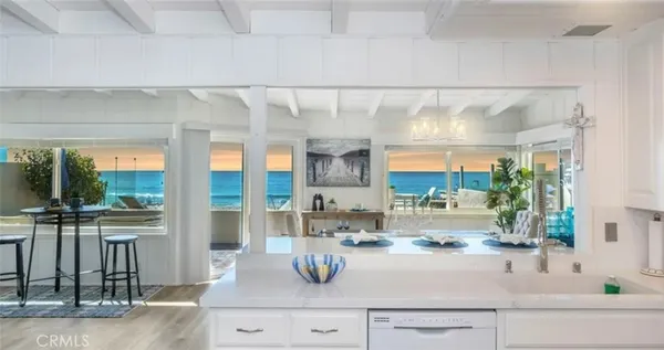 a kitchen with a sink and large window