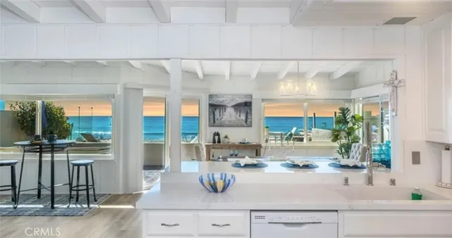 a kitchen with a sink and large window