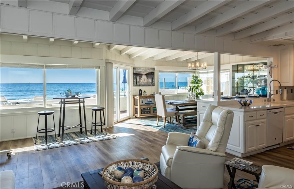 35325 Beach Road Dana Point, CA 92624 - Photo 9 of 44 a living room with furniture a wooden floor and a fireplace