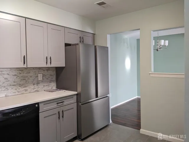 a white refrigerator freezer sitting inside of a kitchen