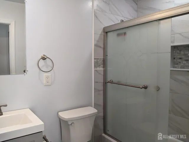 a bathroom with a toilet and a sink
