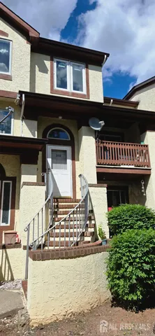 a front view of a house with parking