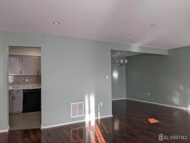 a view of livingroom with hardwood floor and hallway