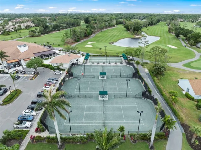 an aerial view of residential houses with outdoor space and street view