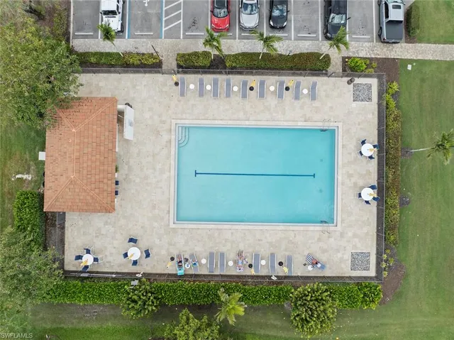a balcony with furniture and a potted plant