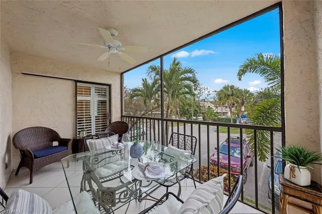 a balcony with furniture and outdoor view