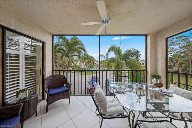 an aerial view of a house with yard and lake view