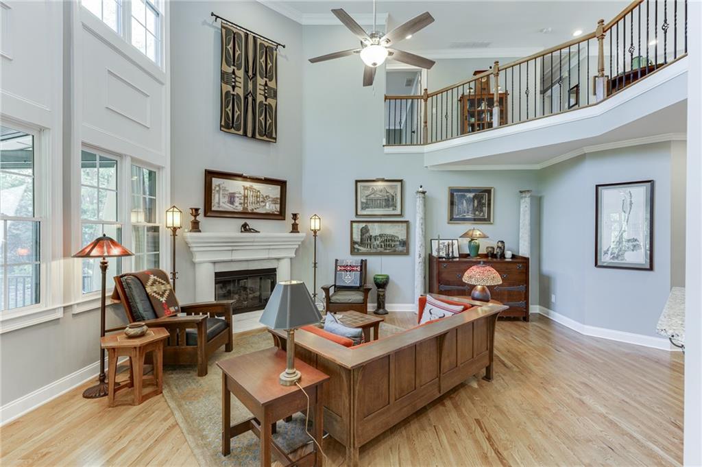2758 Pathview Drive Dacula, GA 30019 - Photo 3 of 48 a living room with furniture a rug and a fireplace