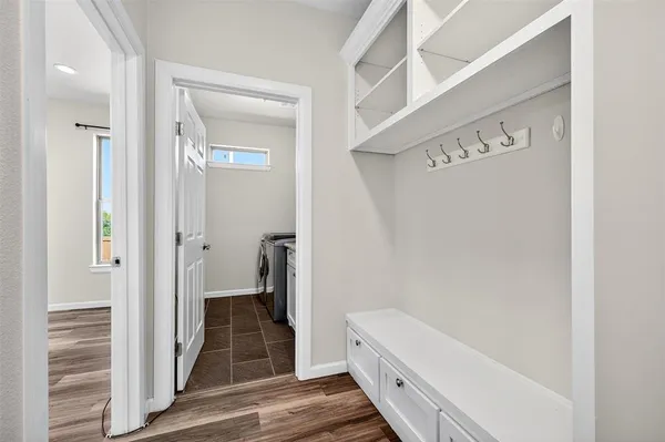 a bathroom with a tub and shower