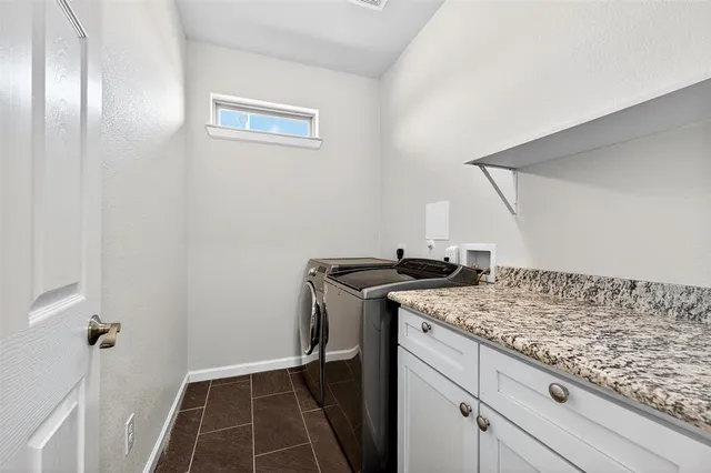 a view of a storage and utility room with a sink