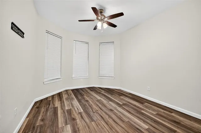 a view of room with a ceiling fan