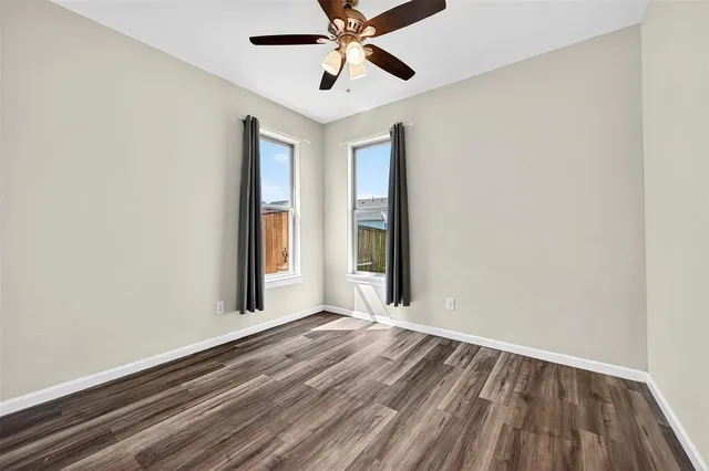 a view of room with window and ceiling fan