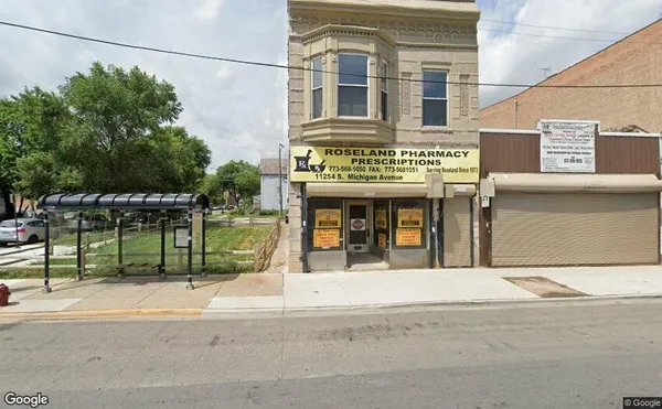 a view of a building with a street