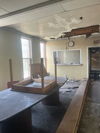 a view of a living room and kitchen