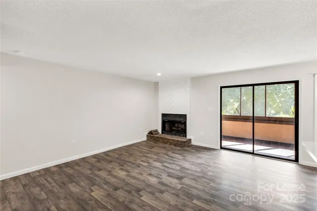 an empty room with large sliding door