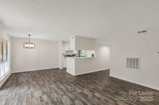 a view of kitchen and wooden floor