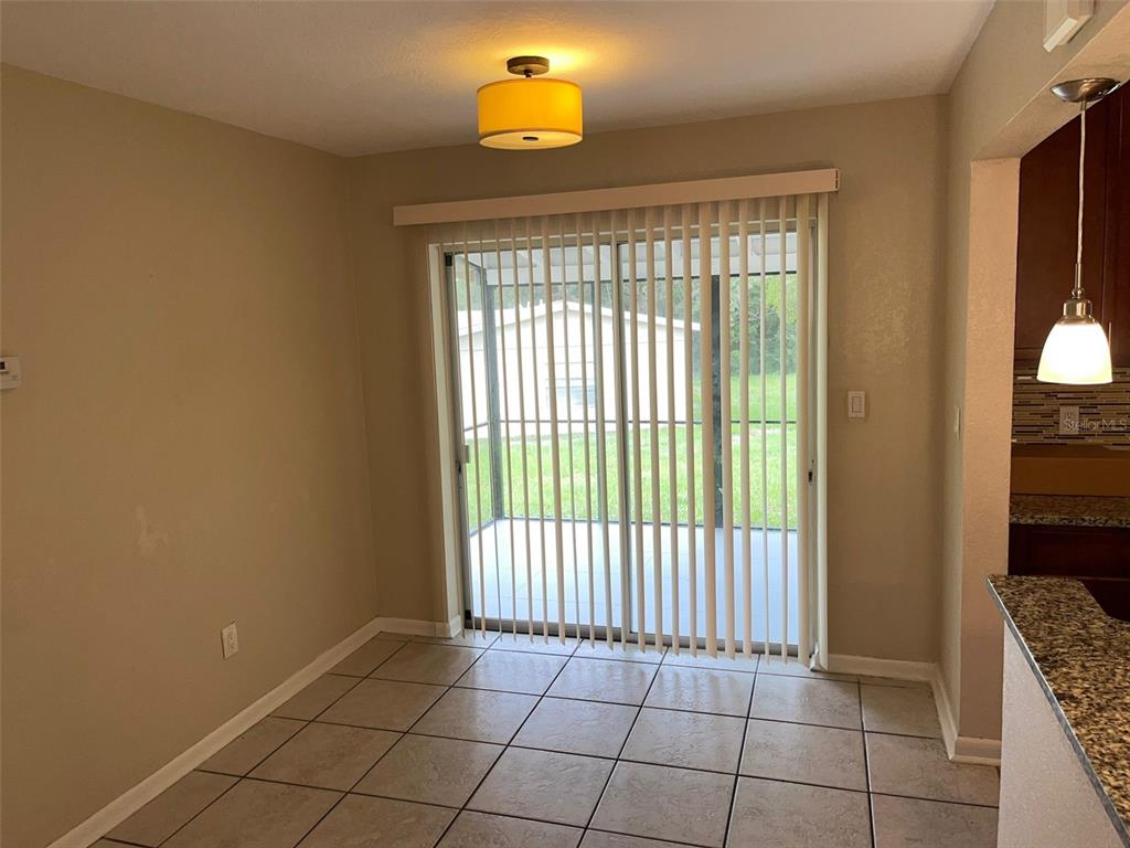 531 Springfield Street Deltona, FL 32725 - Photo 14 of 23 a view of an empty room with a window