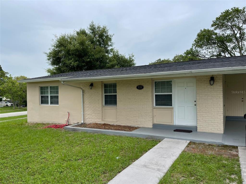 531 Springfield Street Deltona, FL 32725 - Photo 2 of 23 a house view with a garden space