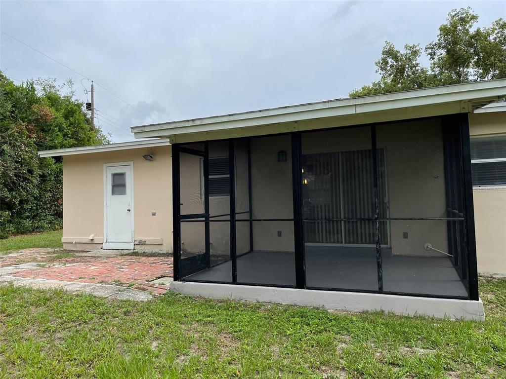 531 Springfield Street Deltona, FL 32725 - Photo 22 of 23 a backyard of a house with lots of green space and wooden fence