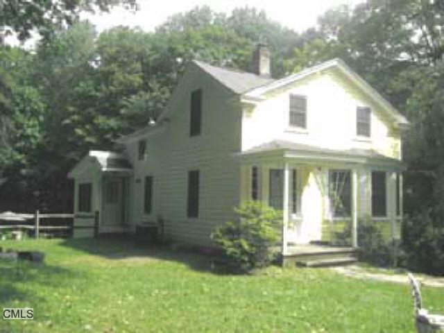 73 West Redding Road Danbury, CT 06810 - Photo 1 of 1 a front view of a house with a yard