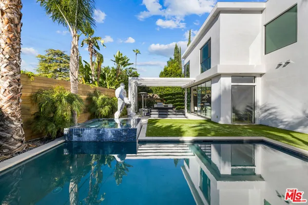 a view of house with swimming pool
