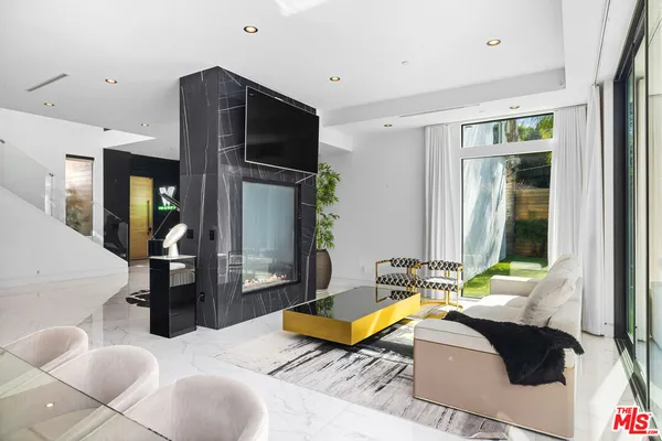 a bed room with furniture and a window