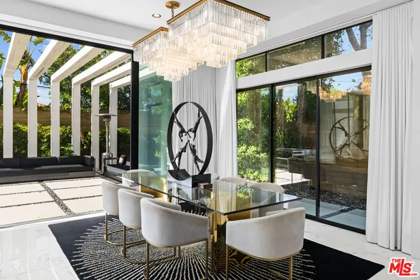 a living room with large windows